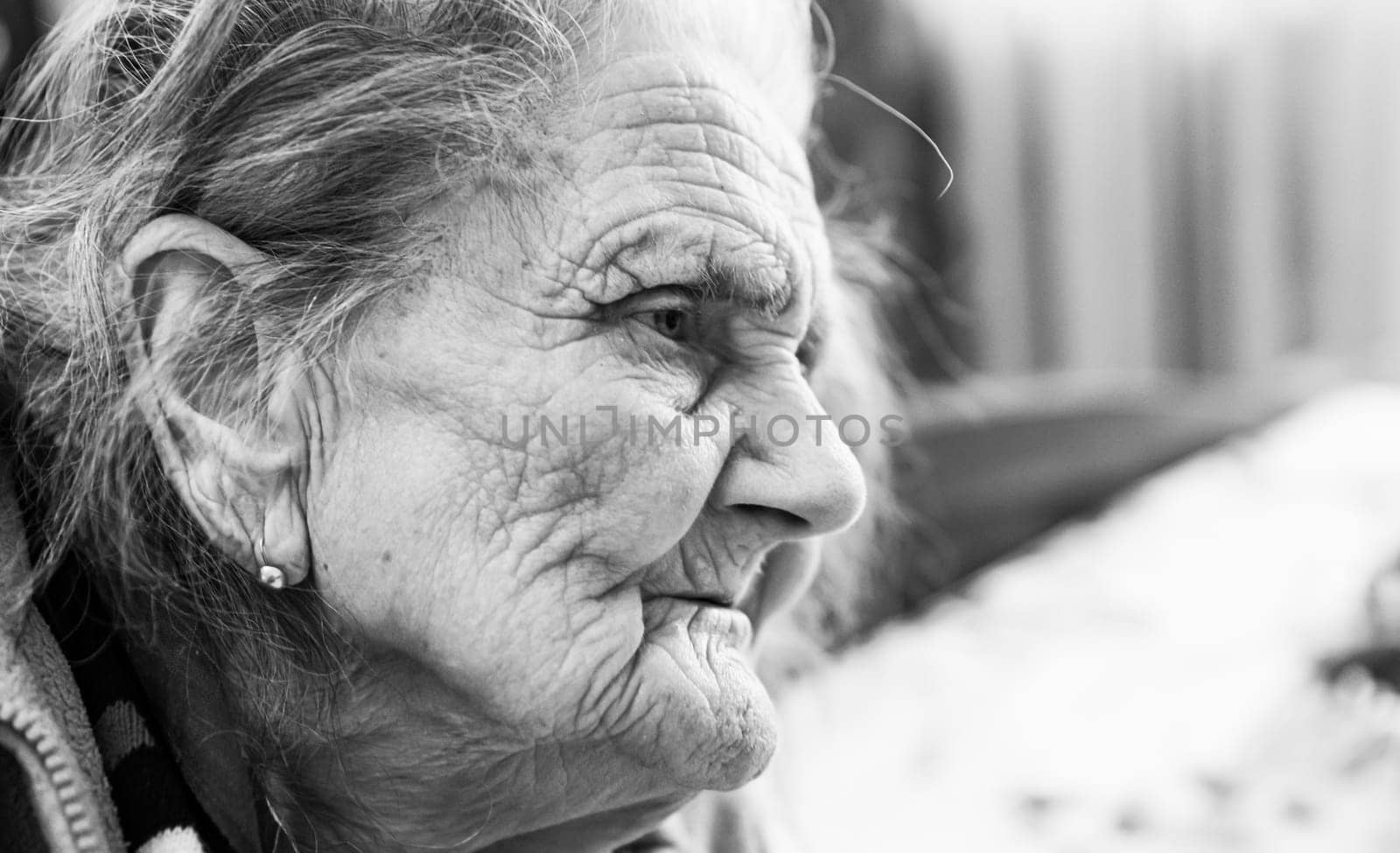 Black and white portrait of very old tired woman in depression. Old woman. 