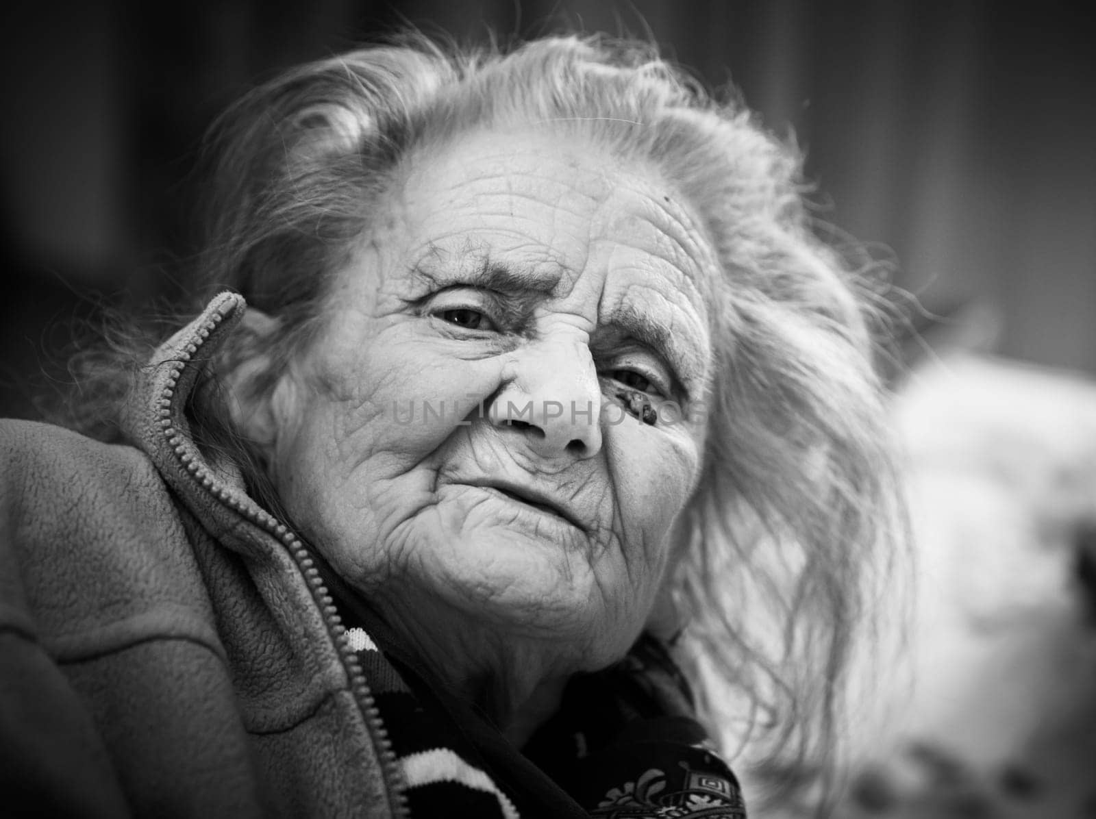 Black and white portrait of very old tired woman in depression. Old woman. 