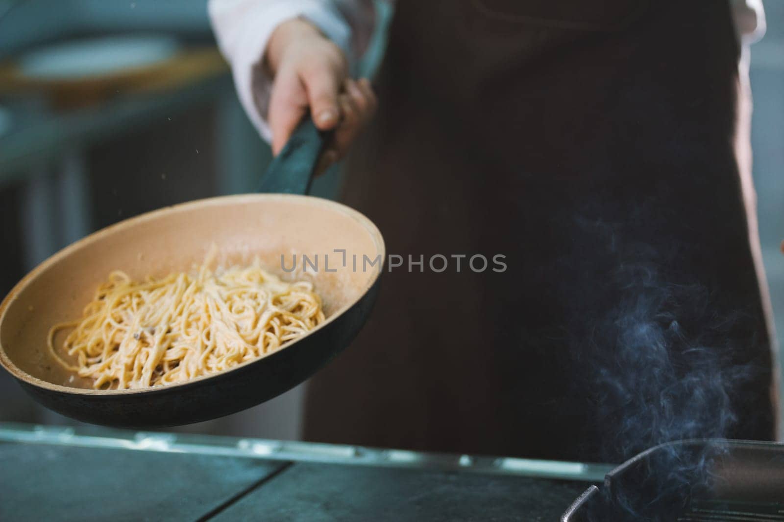 Process of cooking spaghetti with sauce close-up