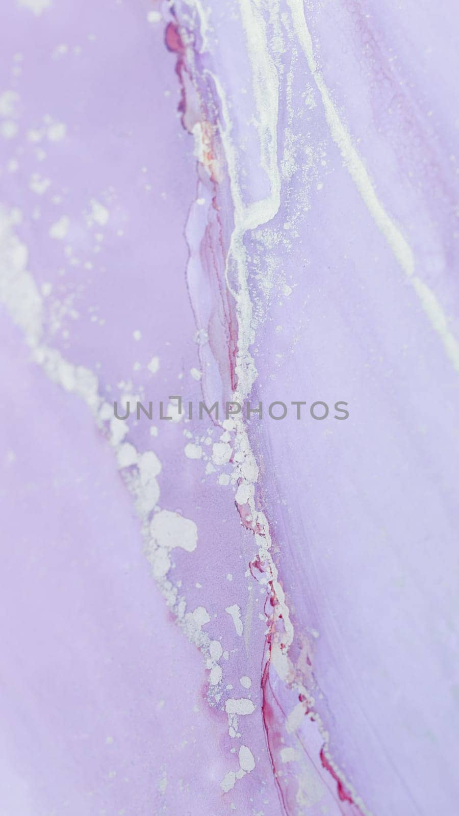A calming, soft lavender marble surface showcases elegant white veining and subtle gold accents, creating a tranquil and stylish background perfect for design.
