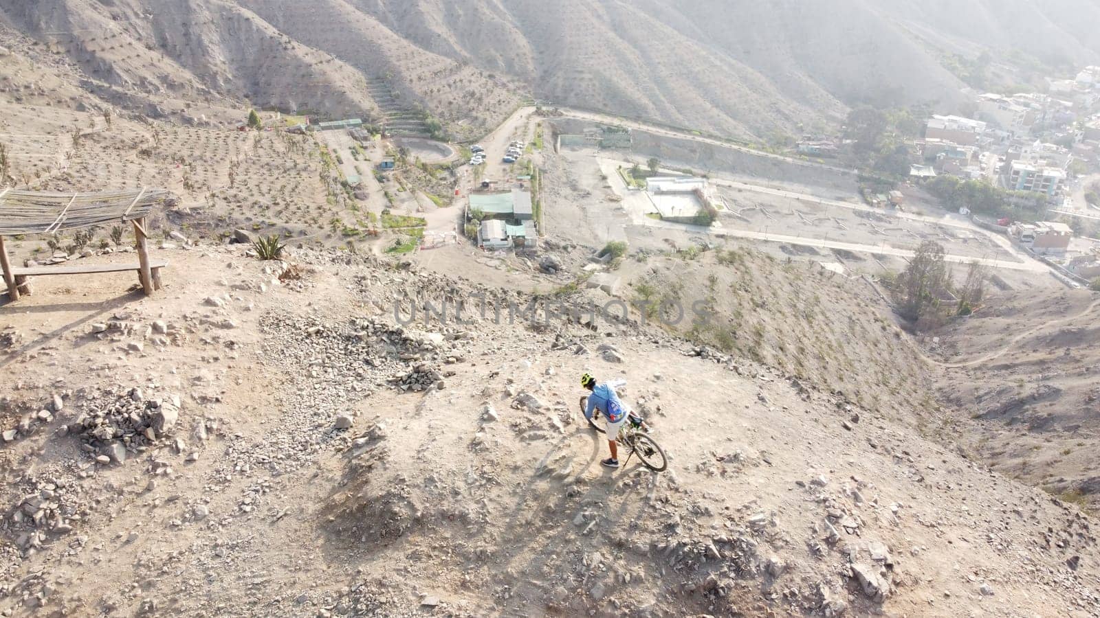 Man riding mountain bikes along the barren rocky terrain