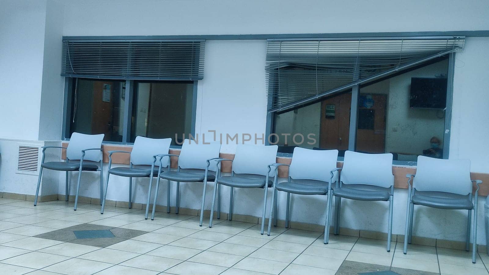 office space, room with windows, chairs along, objects. High quality photo