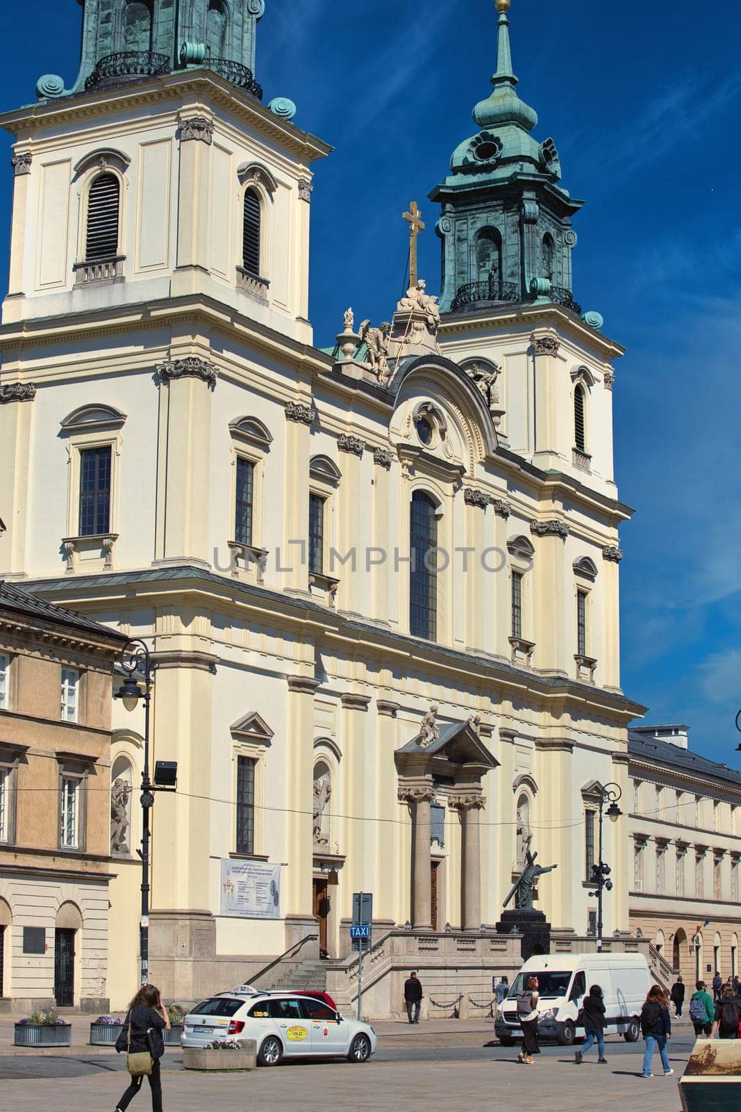 A beautiful view of St. Anne Church, one of Warsaw oldest and most iconic churches. The church stunning Baroque architecture stands prominently in the heart of the city, near the famous Copernicus statue and the Royal Route. Its tall spires and detailed facade make it a must-see historical site for visitors exploring Warsaw rich cultural heritage. Perfect for use in travel, history, and architecture-related themes.
