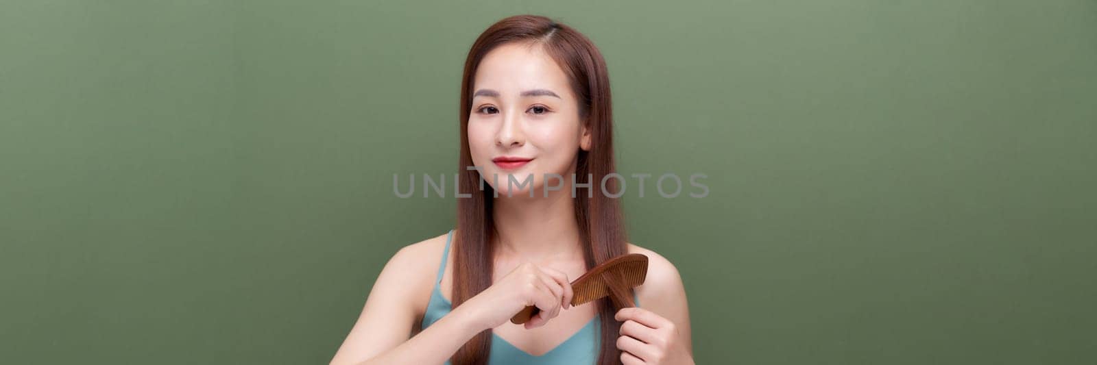 Banner of young woman brushing her hair and smiling isolated over white background by makidotvn