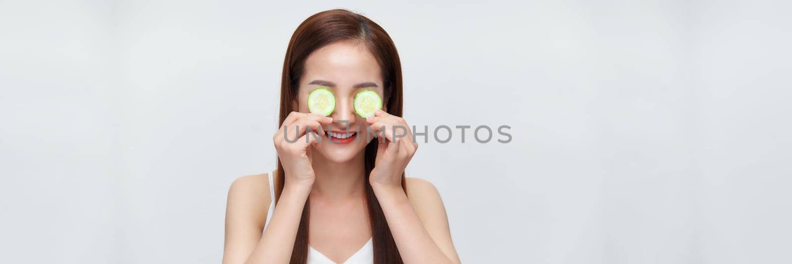 Banner of woman with cucumber slices on her eyes 