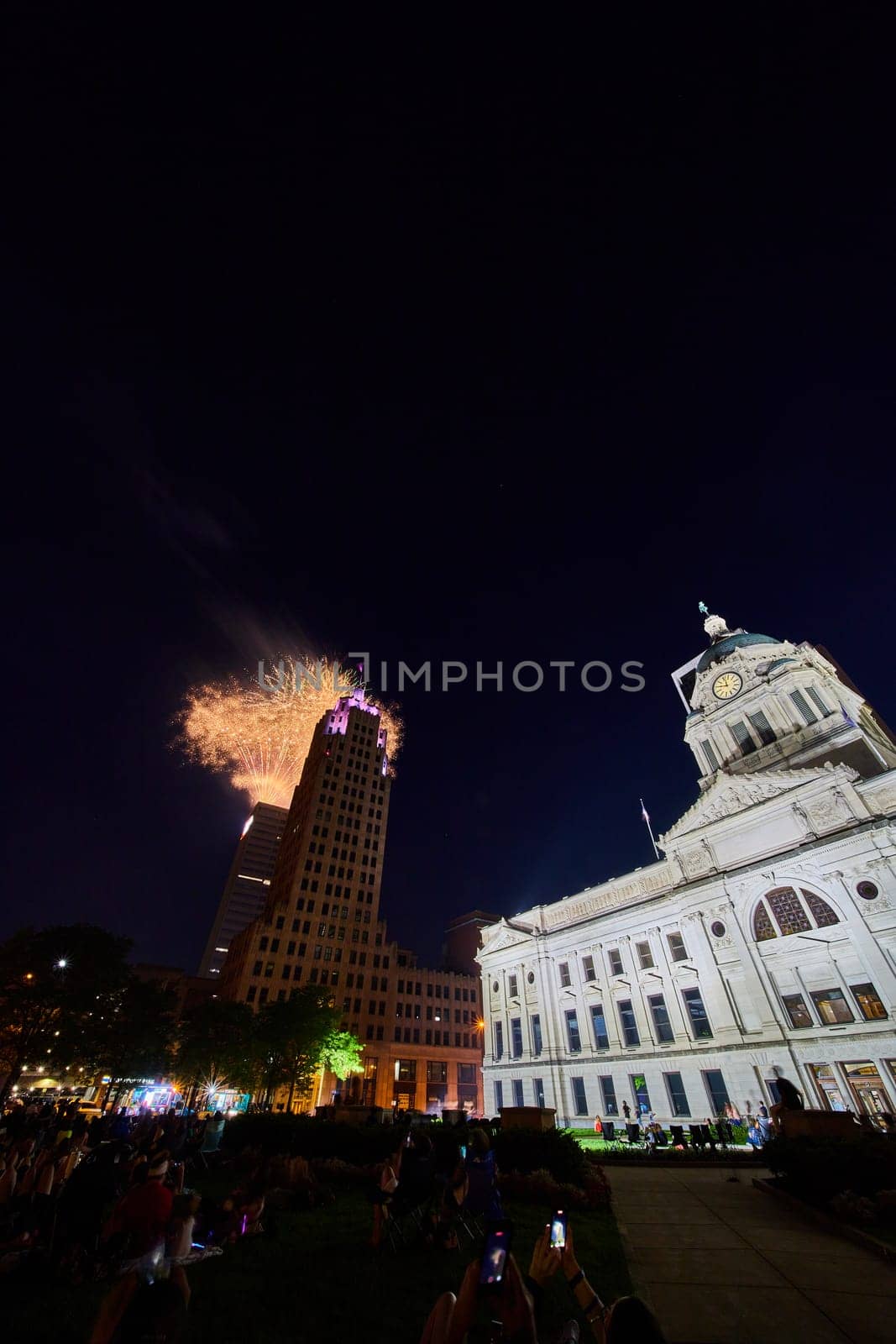Fourth of July in downtown Fort Wayne with courthouse and Lincoln Tower and golden fireworks by njproductions