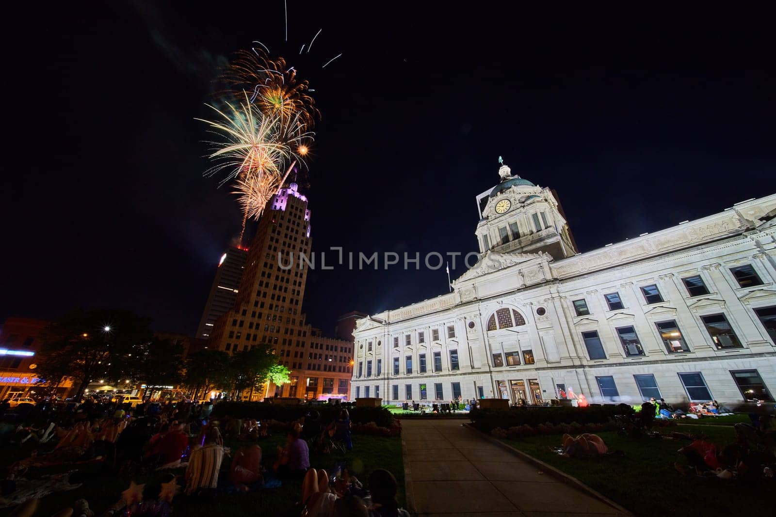 Image of Colorful 4th of July fireworks over Lincoln Tower with courthouse view in Fort Wayne