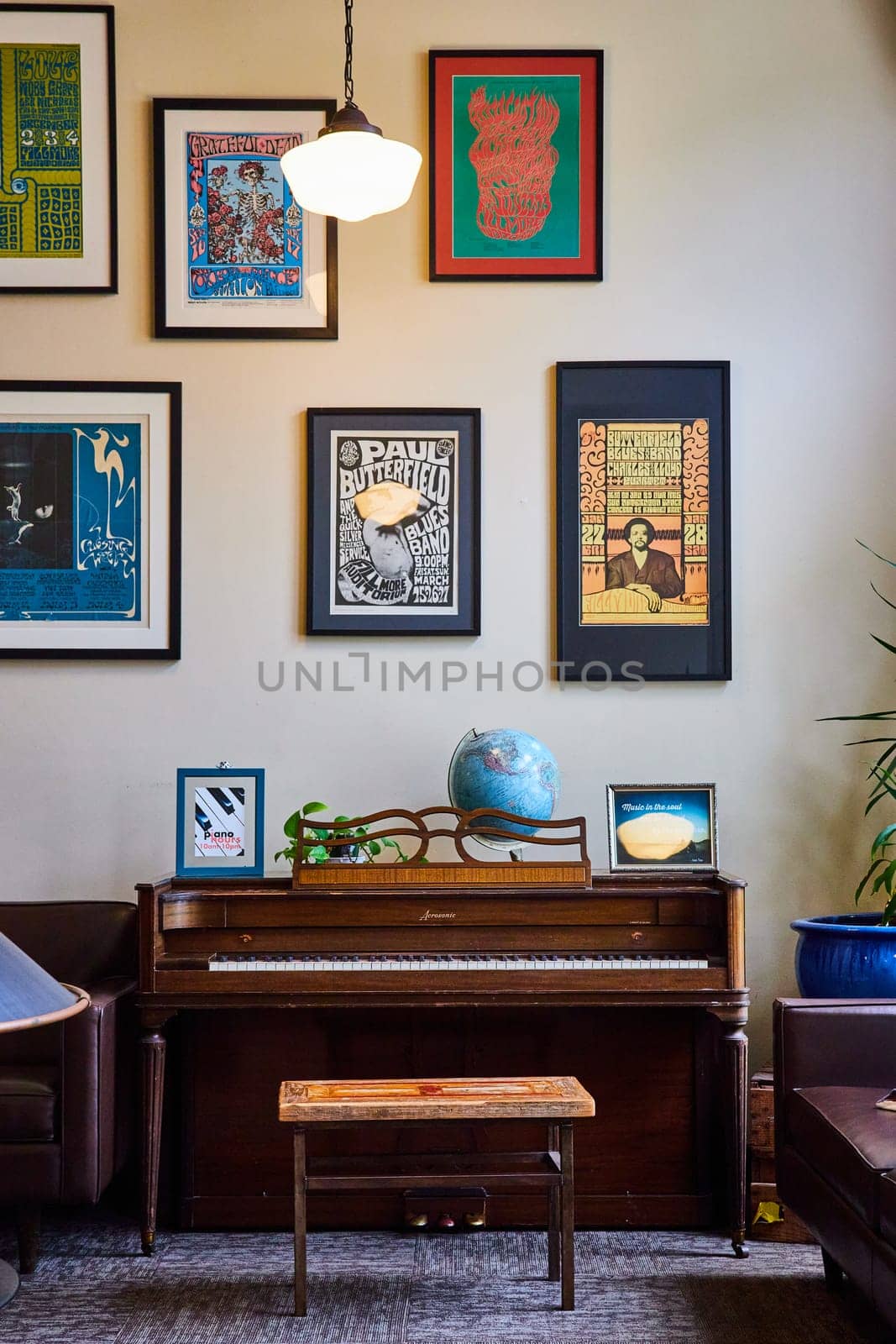 Image of Classic piano against white wall with old fashioned posters in Fort Mason