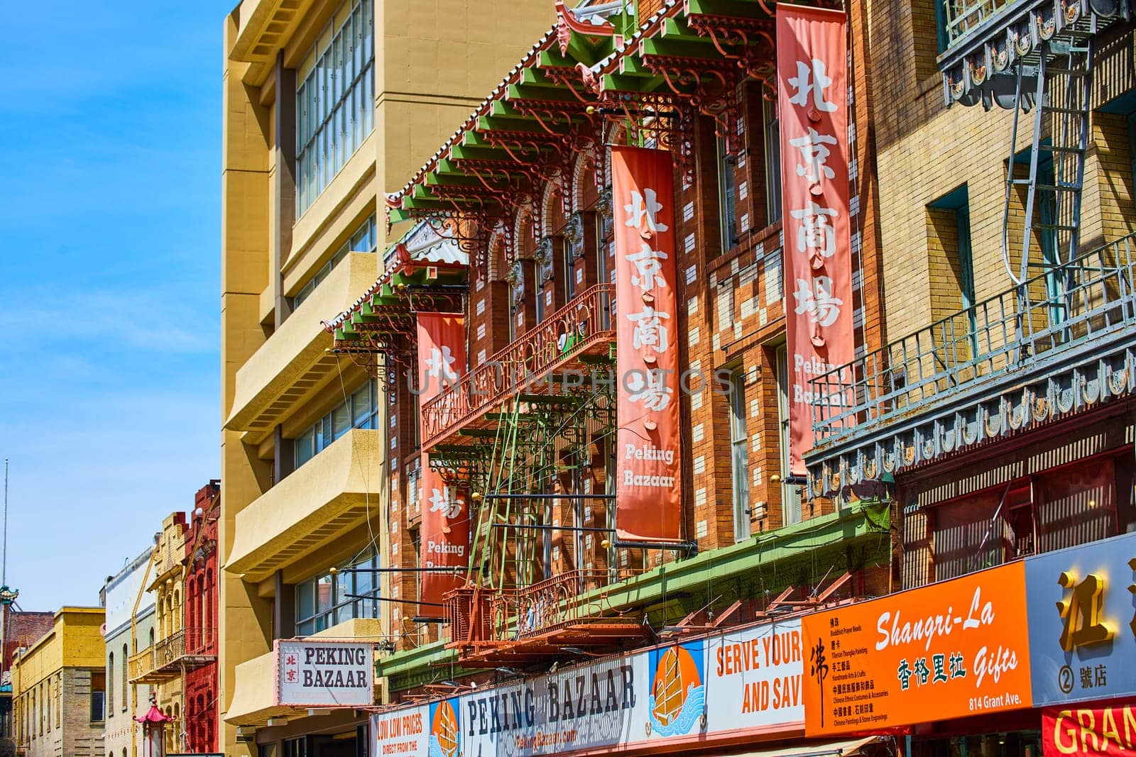 Image of Peking Bazaar building fronts in Chinatown San Francisco with signs and banners