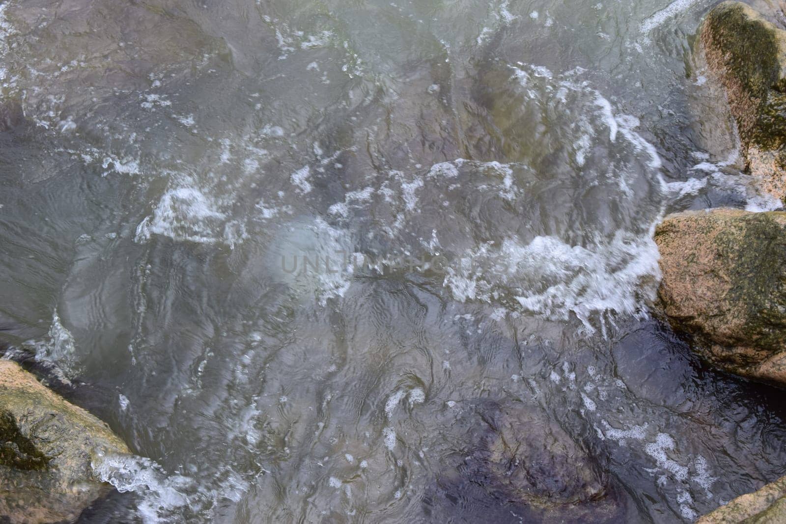 Beating the rock sea wave. Surf, waves, extreme sports.