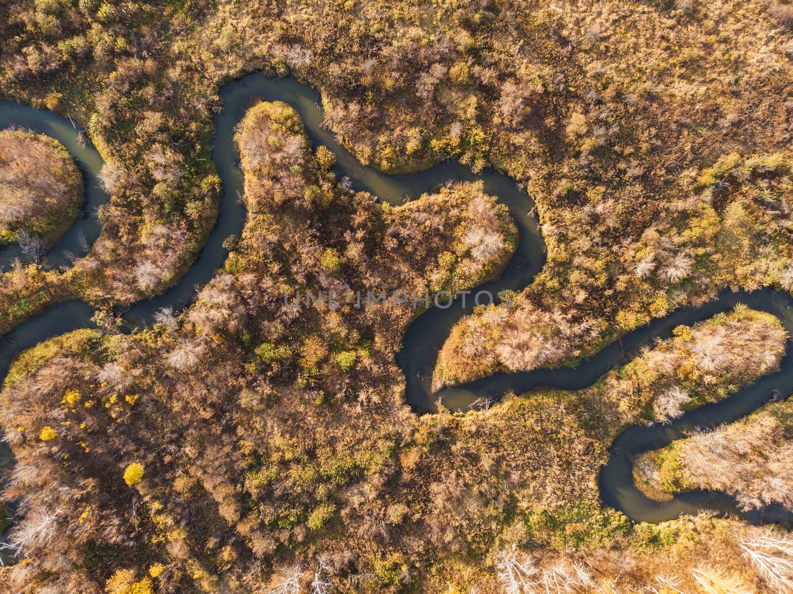 Aerial drone view of autumn landscape with river.