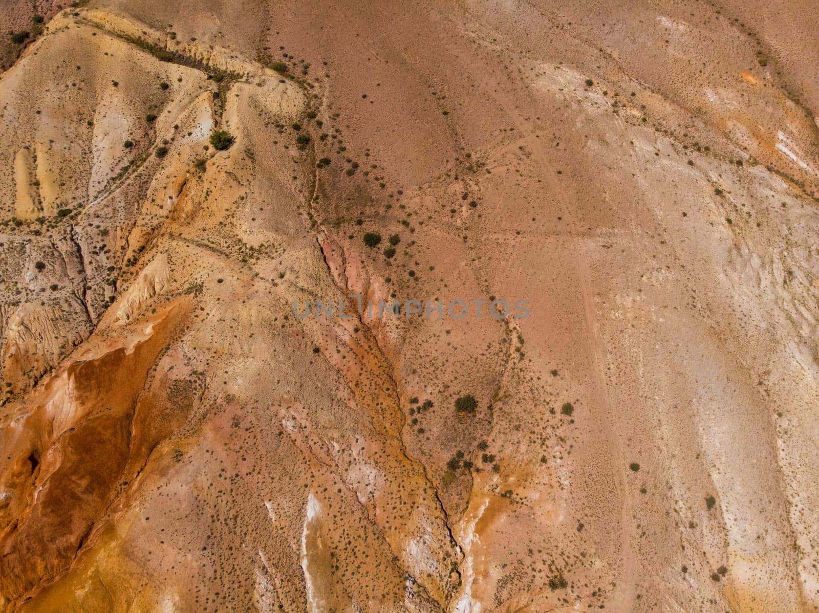 Aerial drone view of colorful eroded landform of Altai mountains in popular tourist location called Mars, Chagan-Uzun, Altai Republic, Russia