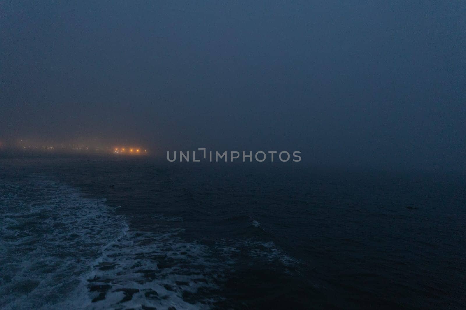 Foggy calm sea in the late evening. Mid shot