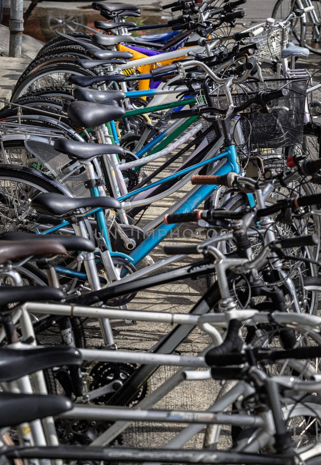 Bangkok, Thailand - 31 Aug, 2024 - Many second hand bikes parked on the street in front of Second-hand bike Shop in bangkok. A lot of old bicycles different brand names for sale, Row of Bicycles parked, Space for text, Selective focus.