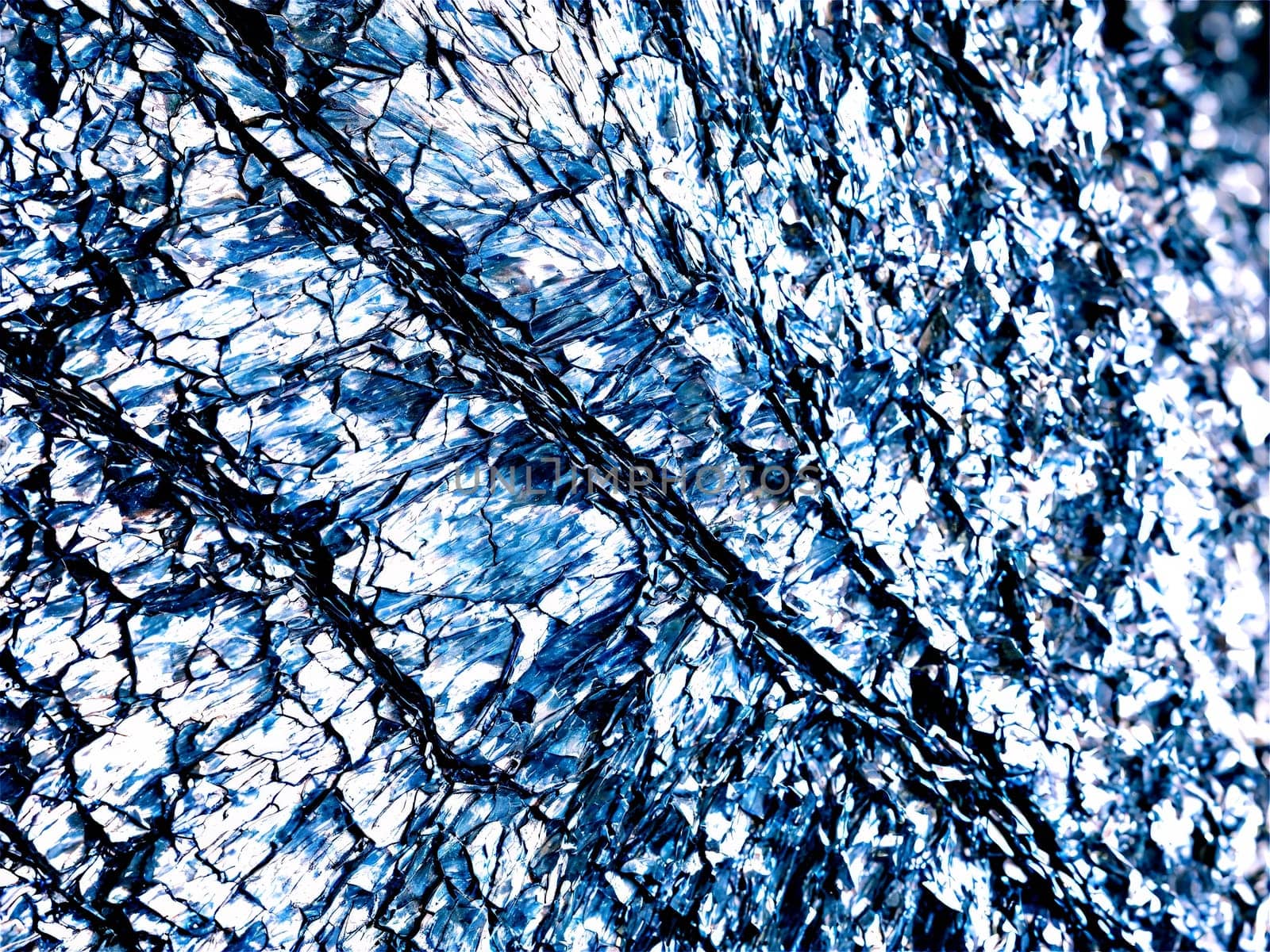 Stone isolated on transparent background. Phyllite A shiny phyllite with a crinkled surface and silvery sheen suspended to show its.