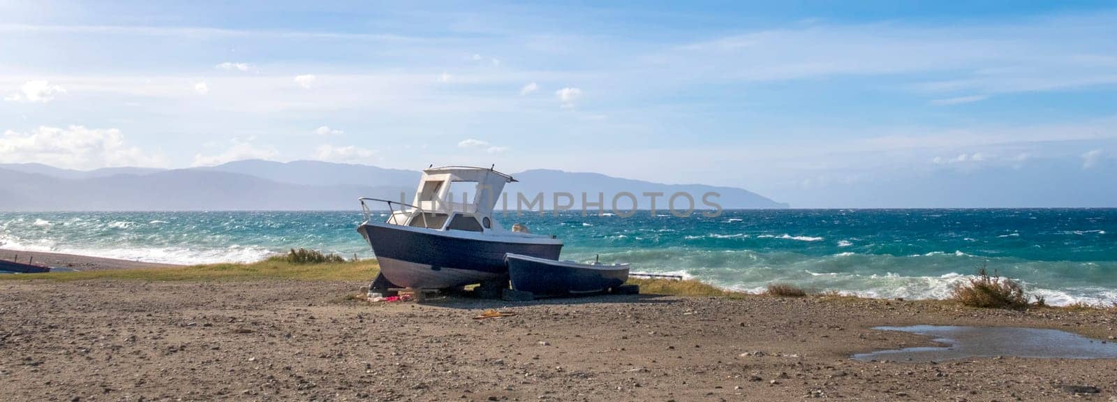 Conceptual view of the lonely boat on the sea beach