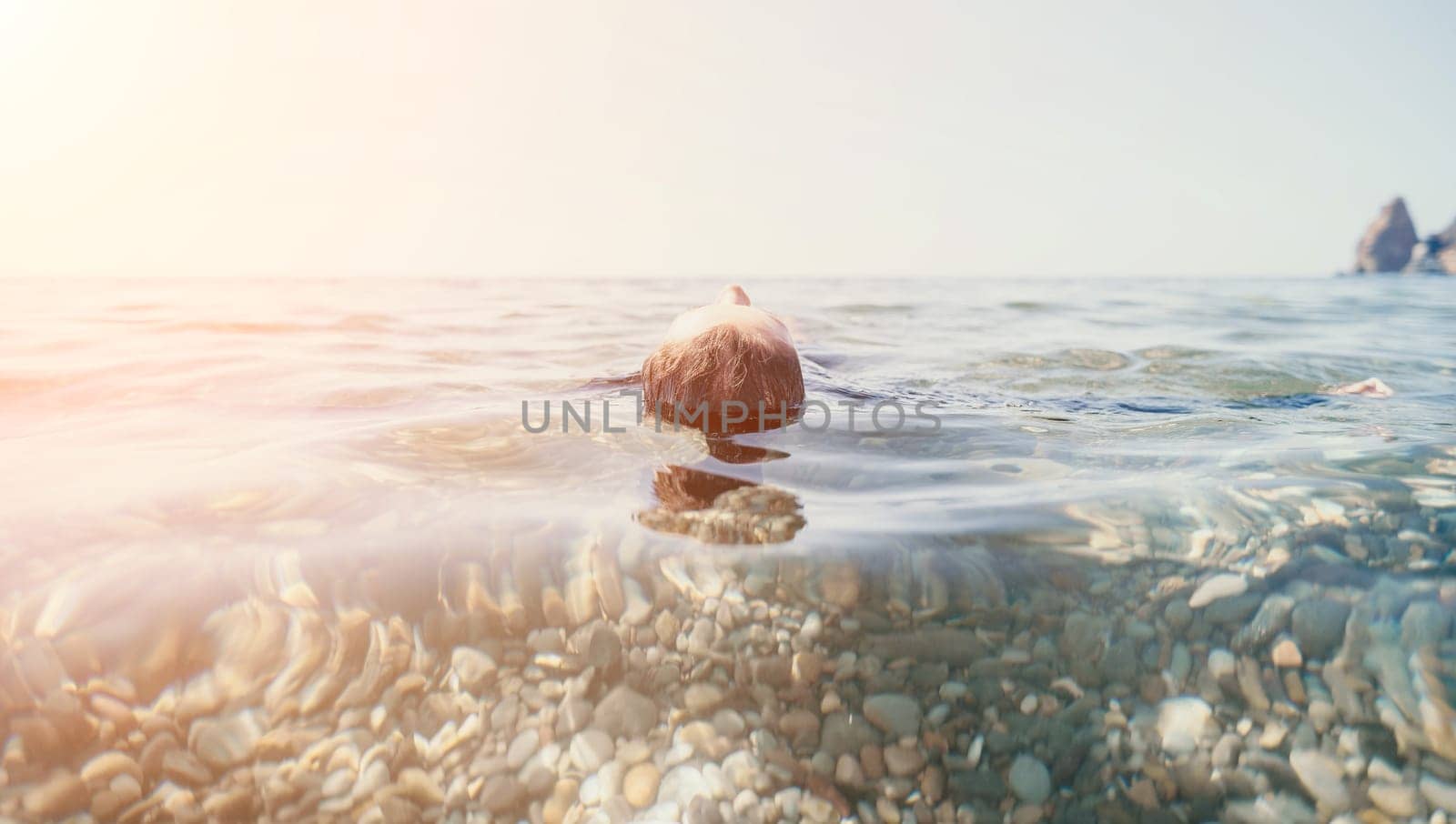 Weight loss and body image concept. Woman with perfect fit body walking confident on beach. Unrecognizable sexy young woman.