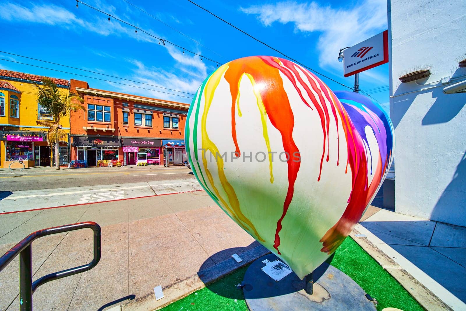 Image of Colorful artwork of large white heart with rainbow colors splashed on top in Castro District