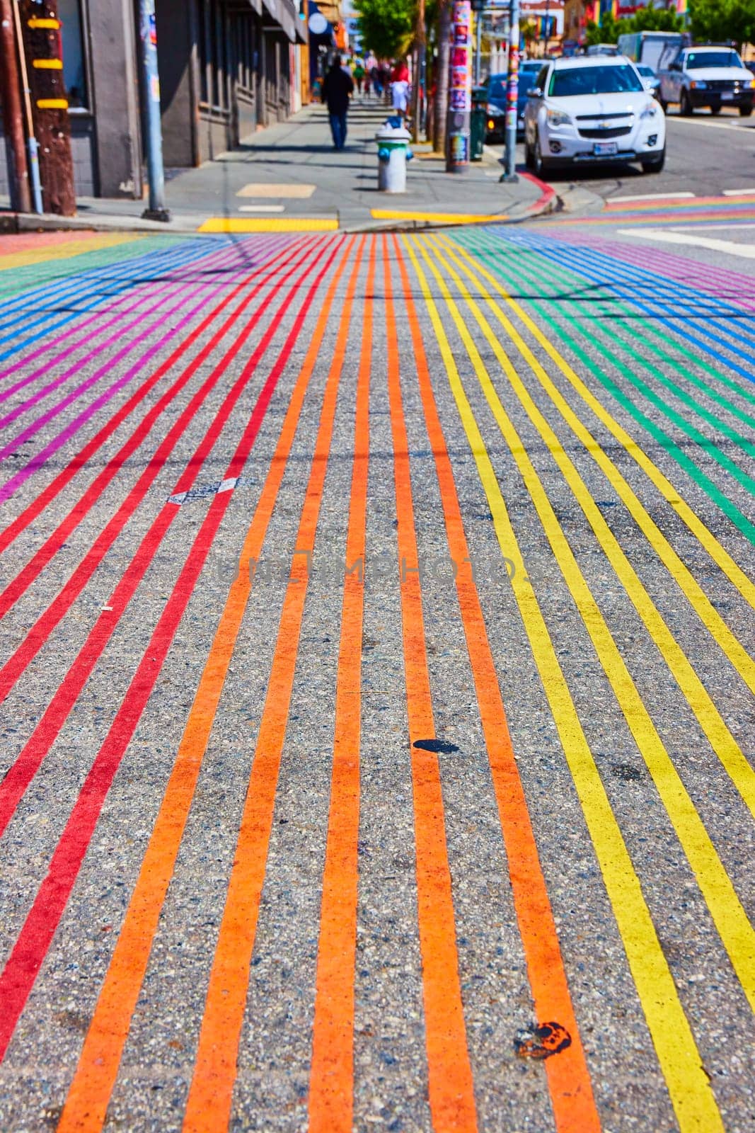 Image of Low view of rainbow crosswalk in Castro District on bright sunny day