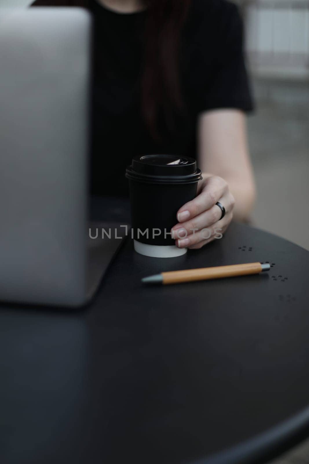 Desk office with laptop, phone, coffee cup, pen on black table. Flat lay top view copy space. Home office. Inspiration moment, workspace or coffee break in the morning. selective focus. by paralisart
