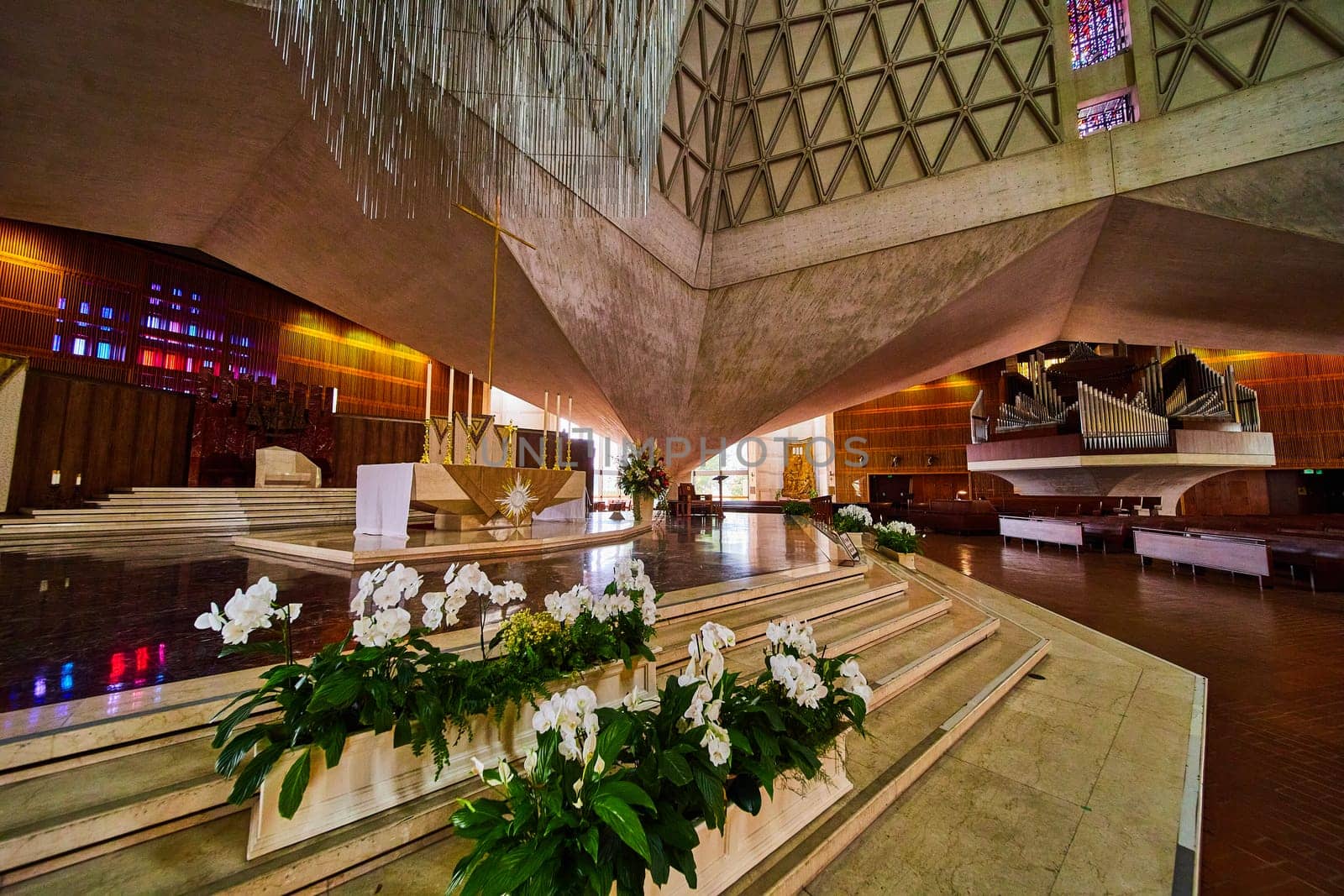 Image of Altar view with flowers and distant organ inside Cathedral of Saint Mary of the Assumption