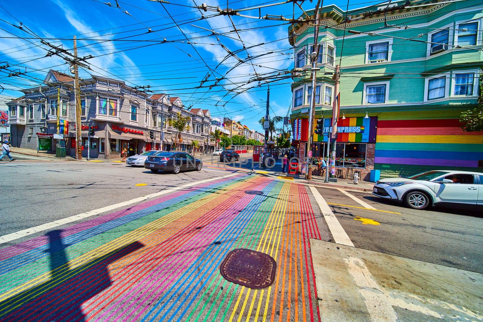 Image of Bright and vibrant rainbow crosswalks in Castro District with storefronts