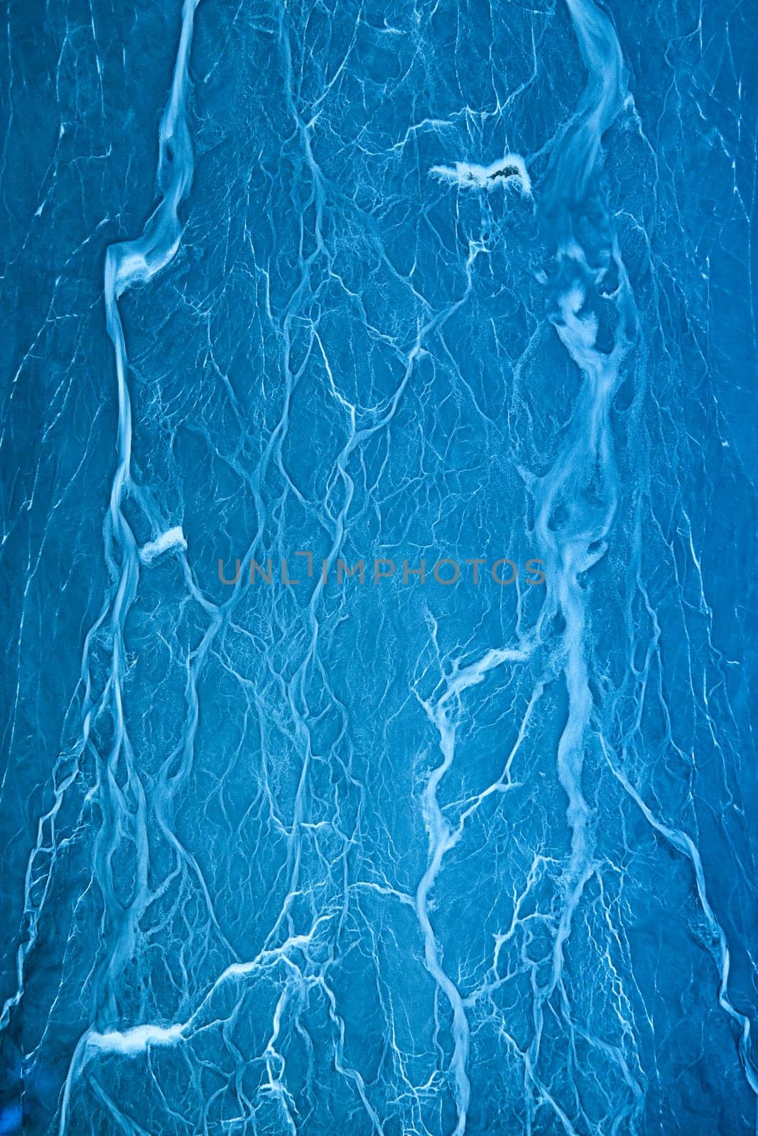 Image of Abstract lightning art on blue background with creamy white lightning vein strikes