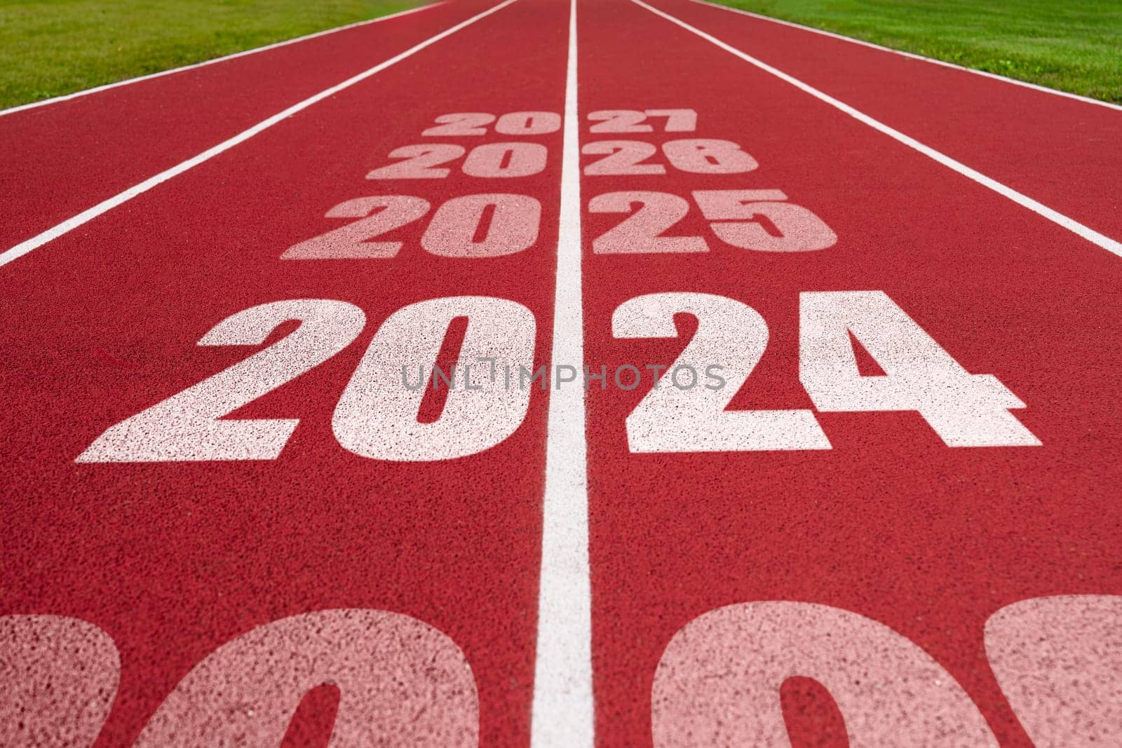 Year 2024 concept, success year. Athletics track with text 2024. Concept of challenge or career path by PhotoTime