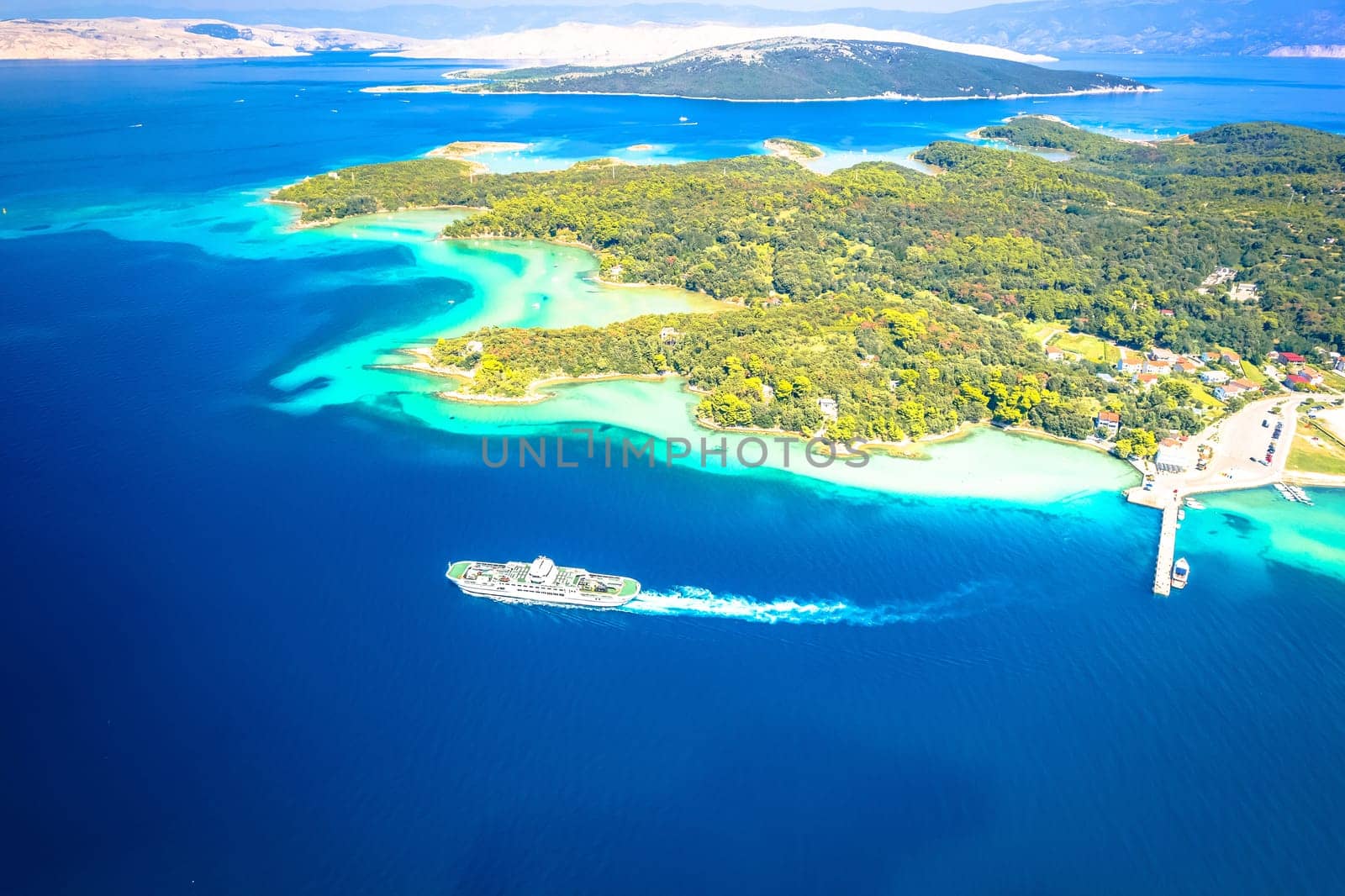 Lopar on Rab island and ferry on the sea aerial view, archipelago of Croatia