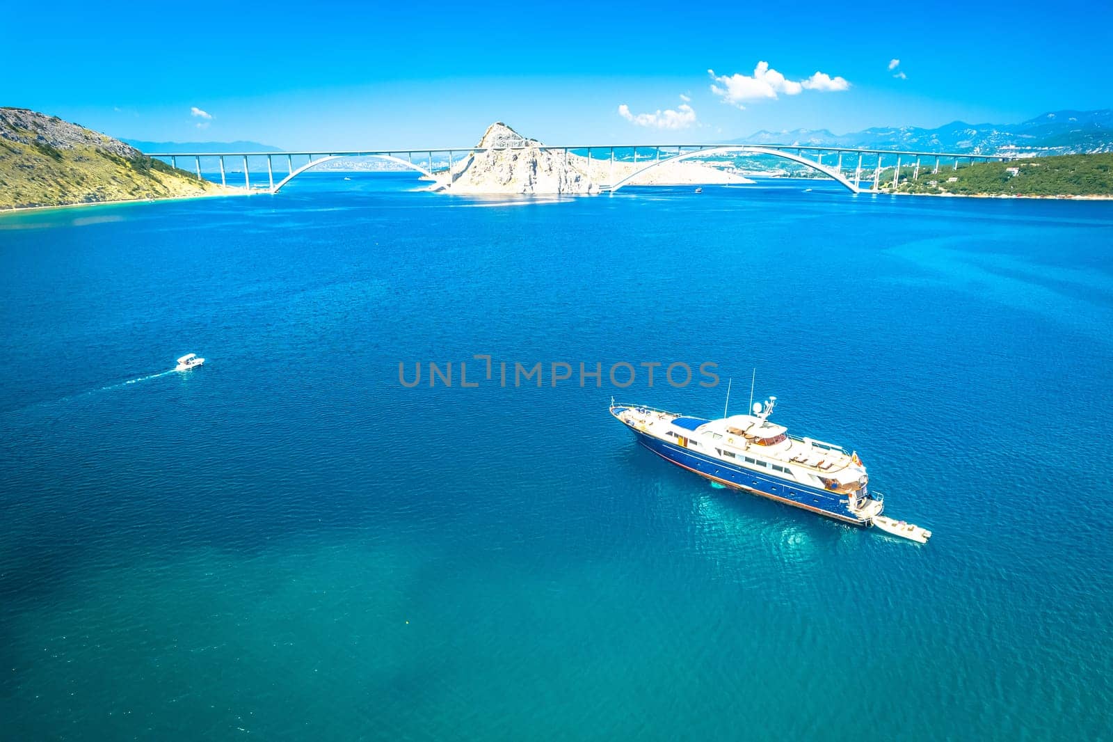 Island of Krk bridge and yacht aerial view, archipelago of Croatia