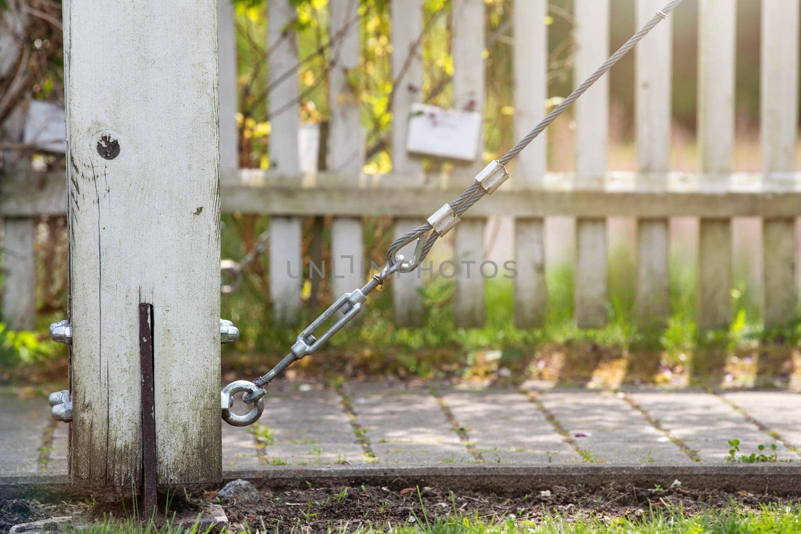 Close-up of a cable tensioner in a park. Fun concept with zip line. To be inserted into a design or project. High quality photo