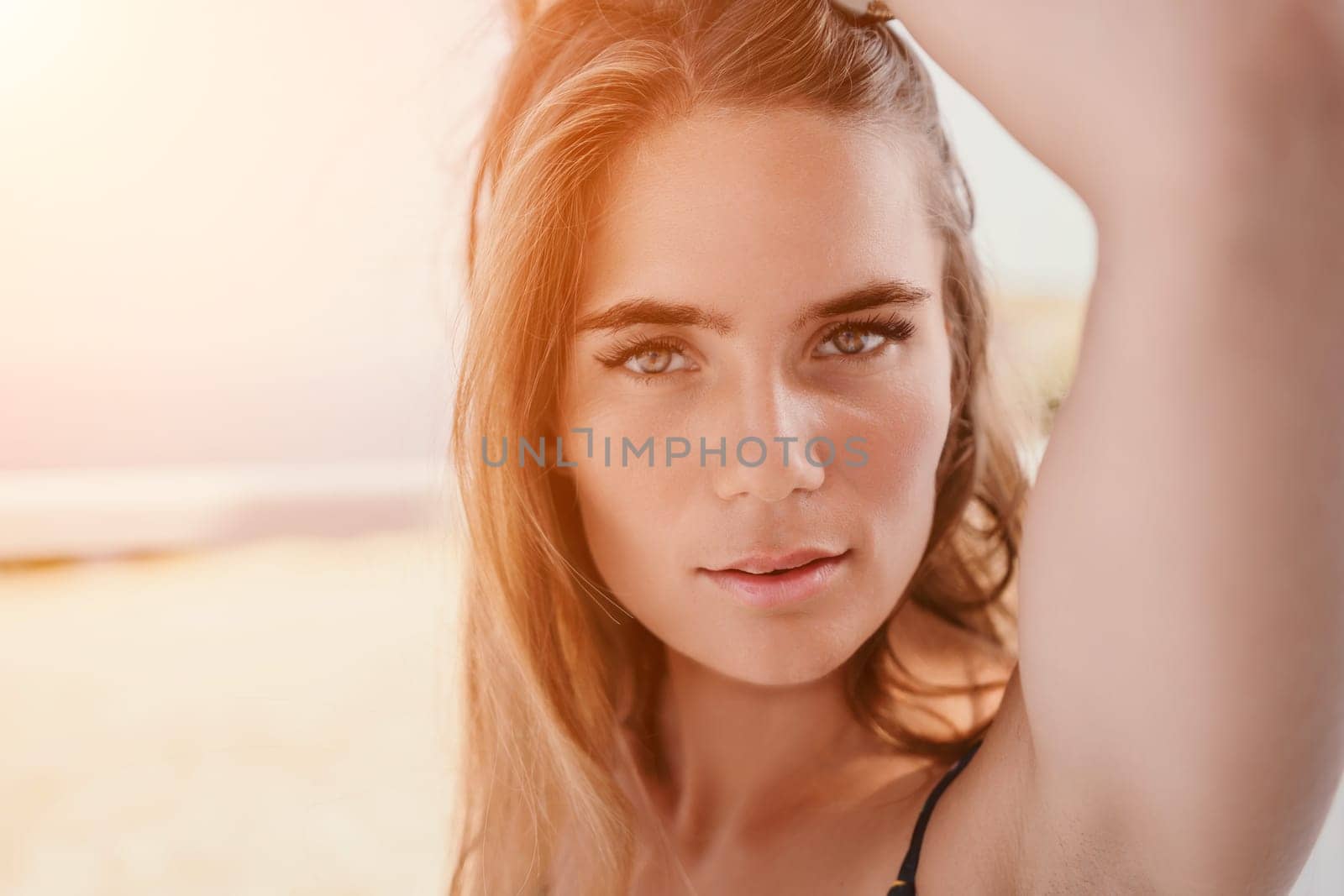 Happy woman portrait in cafe. Boho chic fashion style. Outdoor photo of young happy woman with long hair, sunny weather outdoors sitting in modern cafe