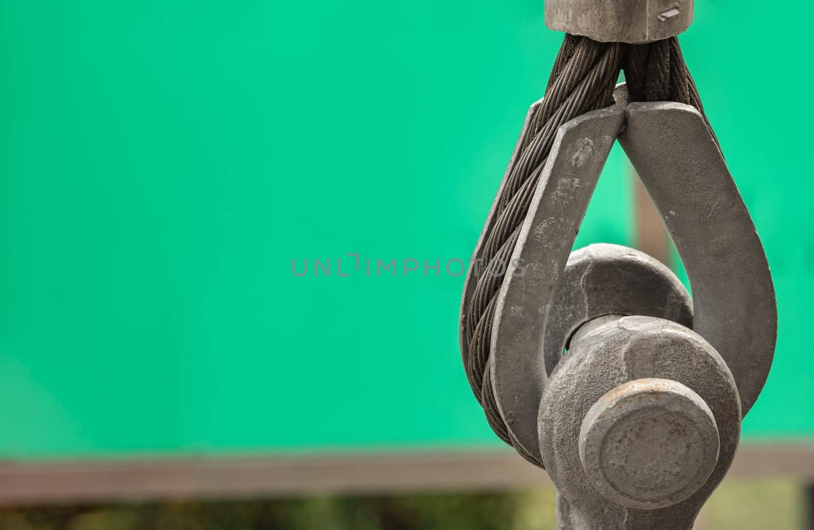 Metal ring and Steel cabling attached to a shackle. Steel wire rope slings with Thimble and safety anchor shackle turnbuckle connection bolt for heavy work, Device for adjusting the tension or length cable, Copy space, Selective Focus.