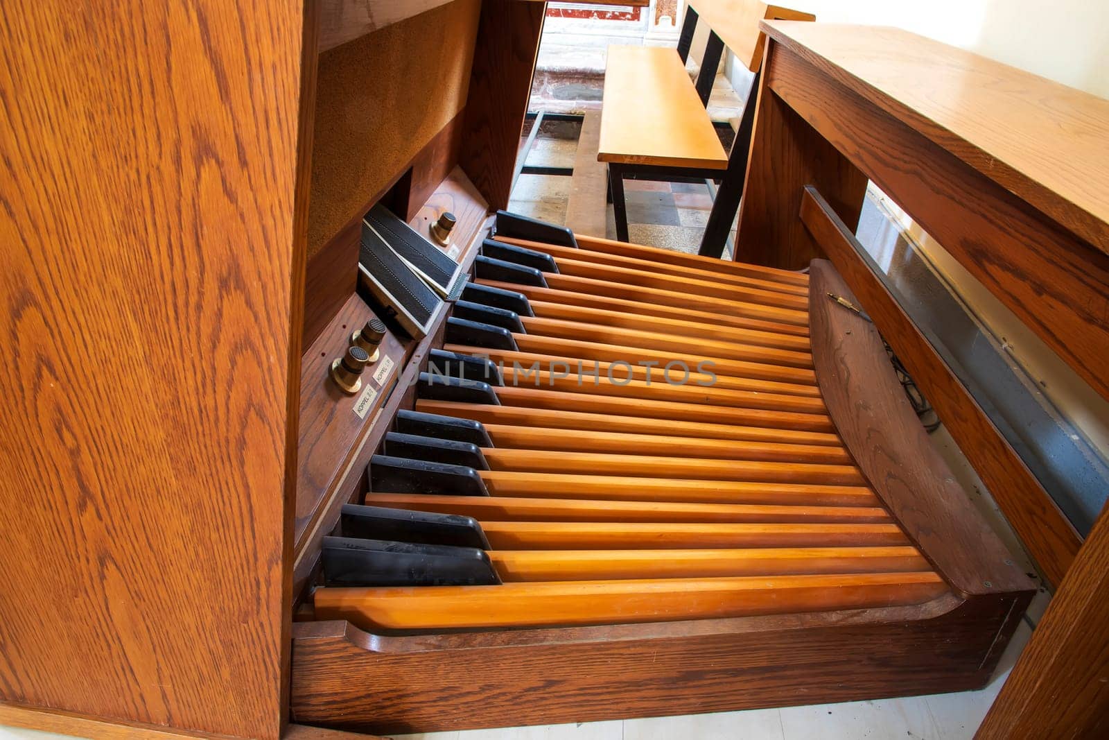 Wooden Keyboard and pedal organ close up.