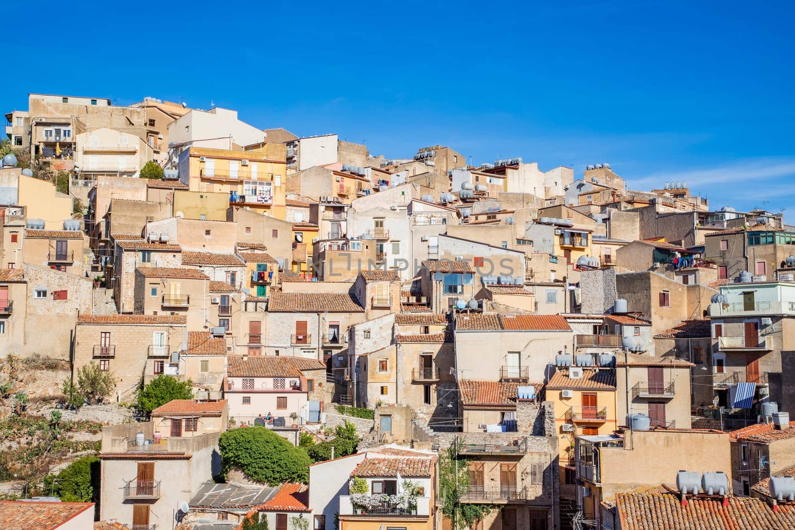 Facade of many houses on a hill