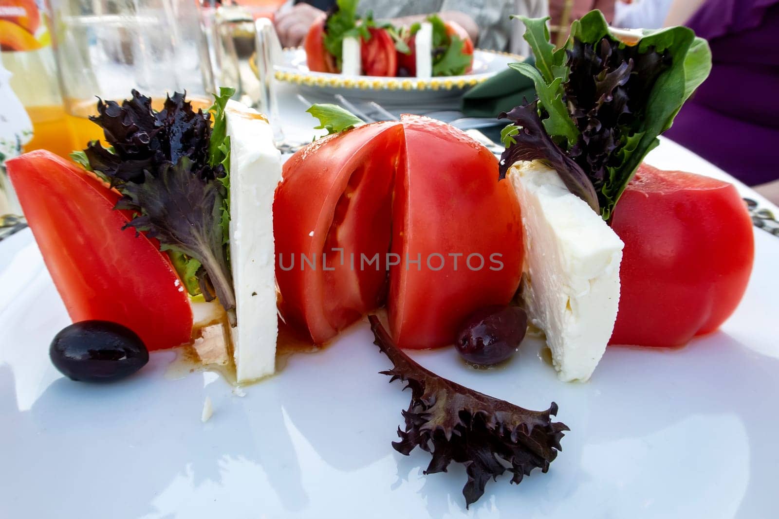 Art view of traditional Italian Caprese salad on the plate. Close view. 