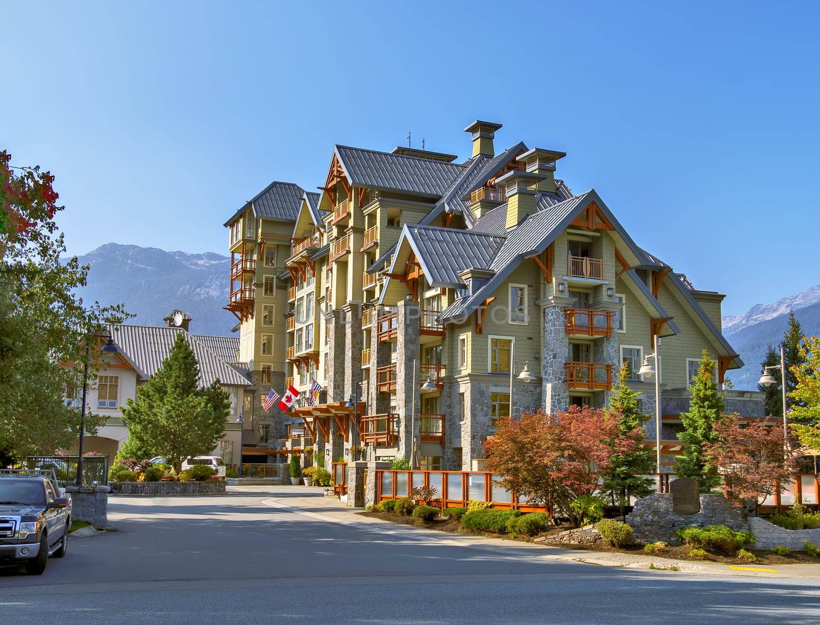 One of a resort residential building in Whistler on mountain and blue sky background.