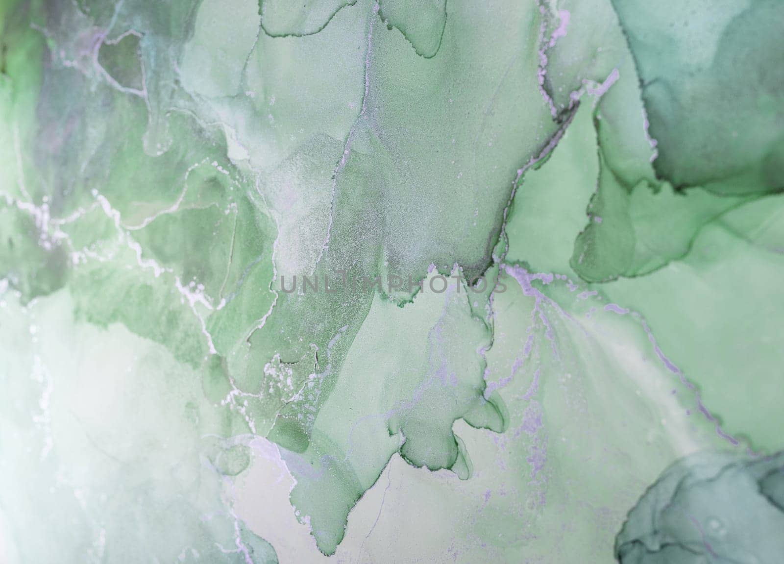 Delicate shades of green blend harmoniously, creating an abstract composition with fluid textures. This artwork evokes calmness and nature's beauty through gentle swirls.