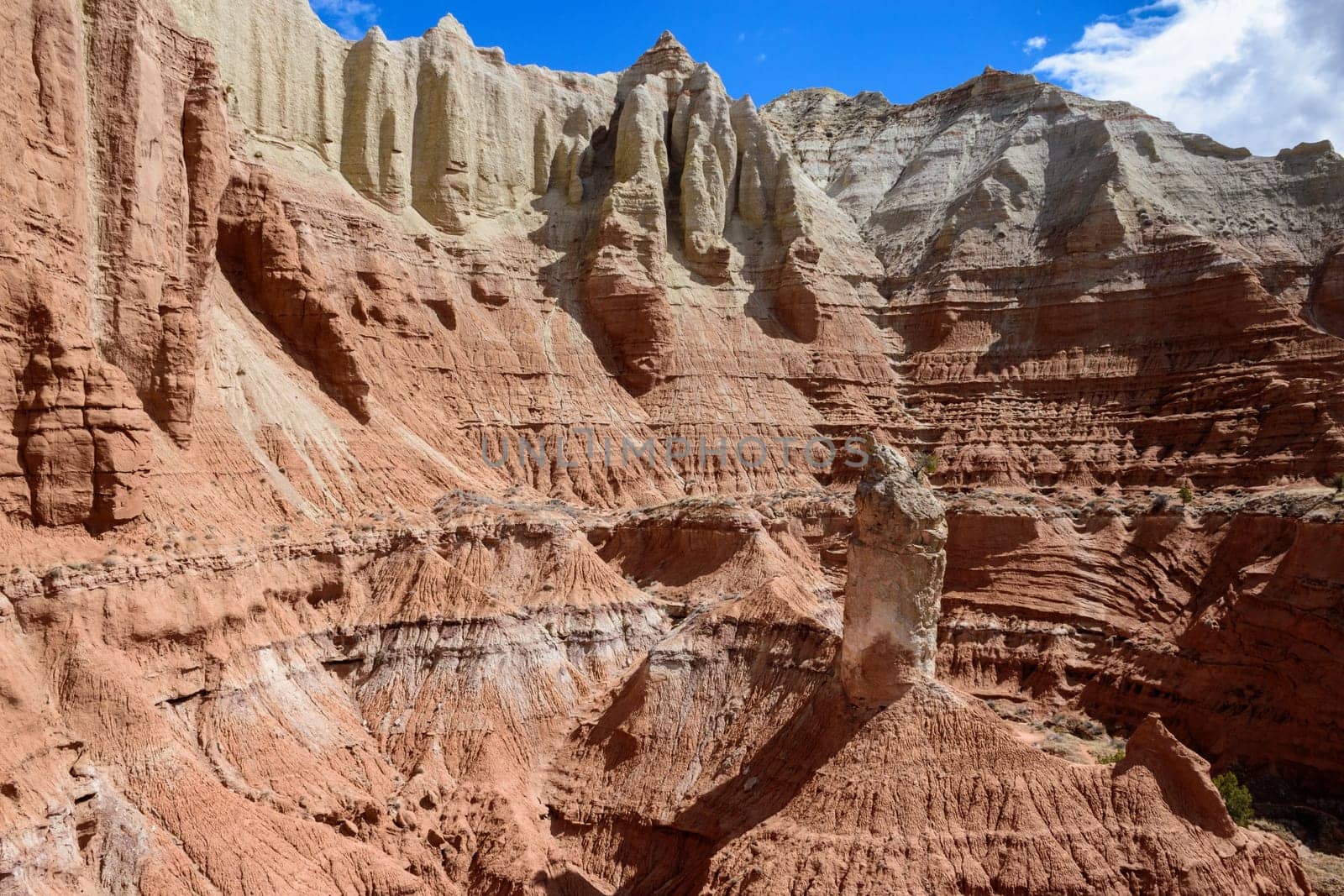 Marvel at the unique rock formations in Kodachrome Basin State Park, Utah. The striking layers and vibrant colors of the sandstone cliffs stand against a blue sky Showcasing the geology - USA