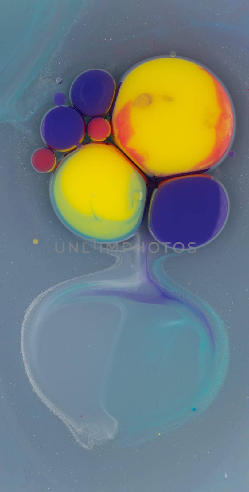 A mesmerizing arrangement of colorful bubbles in various sizes floats in a liquid medium, forming captivating patterns that draw the eye and spark curiosity.