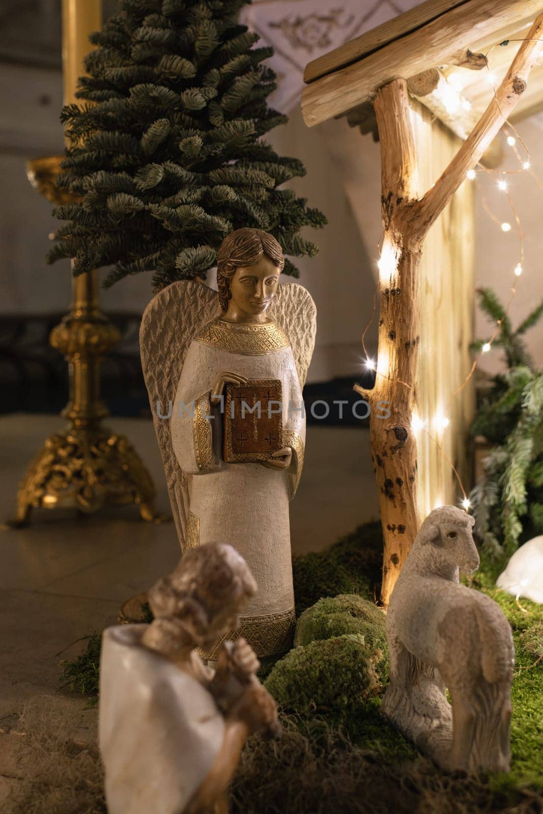 Angel with wings holds a bible in his hands Scene of the birth of Jesus Christ