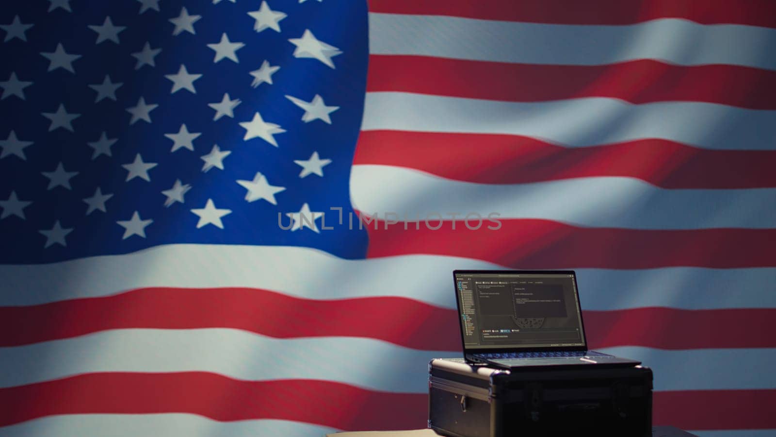 Laptop in CIA command center used by counterterrorism agents to run surveillance efforts against enemy of United States in conformity with Patriot Act law, isolated over USA flag, camera B