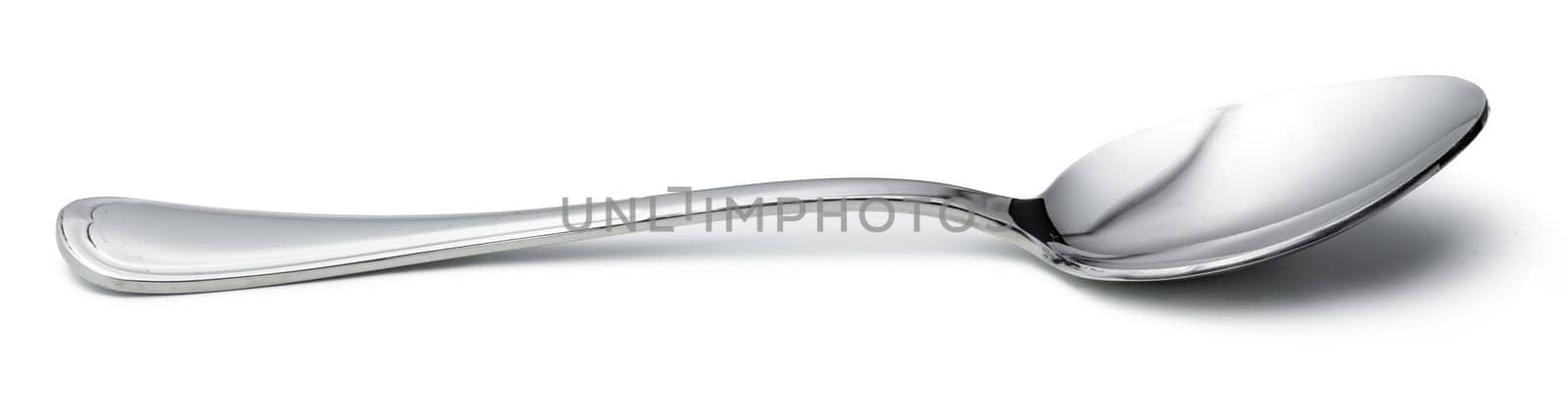 Silver shiny spoon isolated on white background