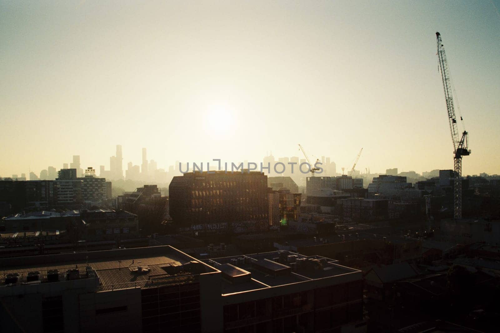 MELBOURNE, AUSTRALIA - JULY 31, 2024: View towards Melbourne skyline from a high rise building in Cremorne on a cold winter's afternoon in Australia. Shot with analogue film.