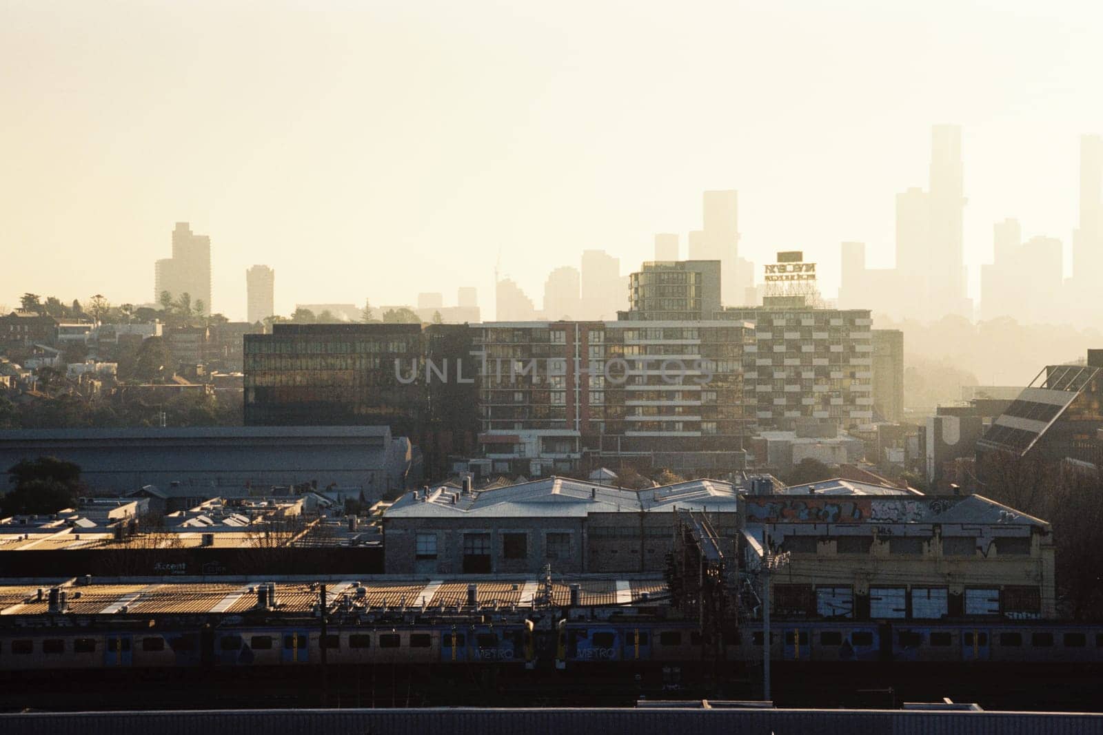 MELBOURNE, AUSTRALIA - JULY 31, 2024: View towards Melbourne skyline from a high rise building in Cremorne on a cold winter's afternoon in Australia. Shot with analogue film.