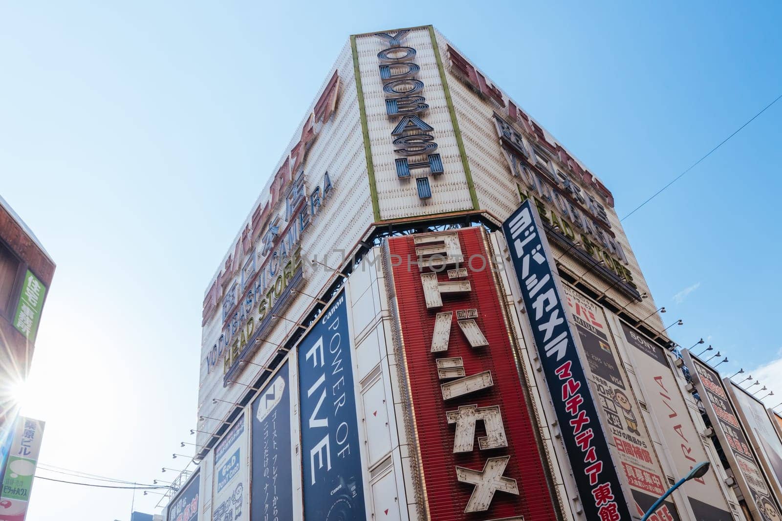 TOKYO, JAPAN - MAY 18 2019: Tokyo’s busy Shinjuku neighborhood during the day around Yodobashi camera store