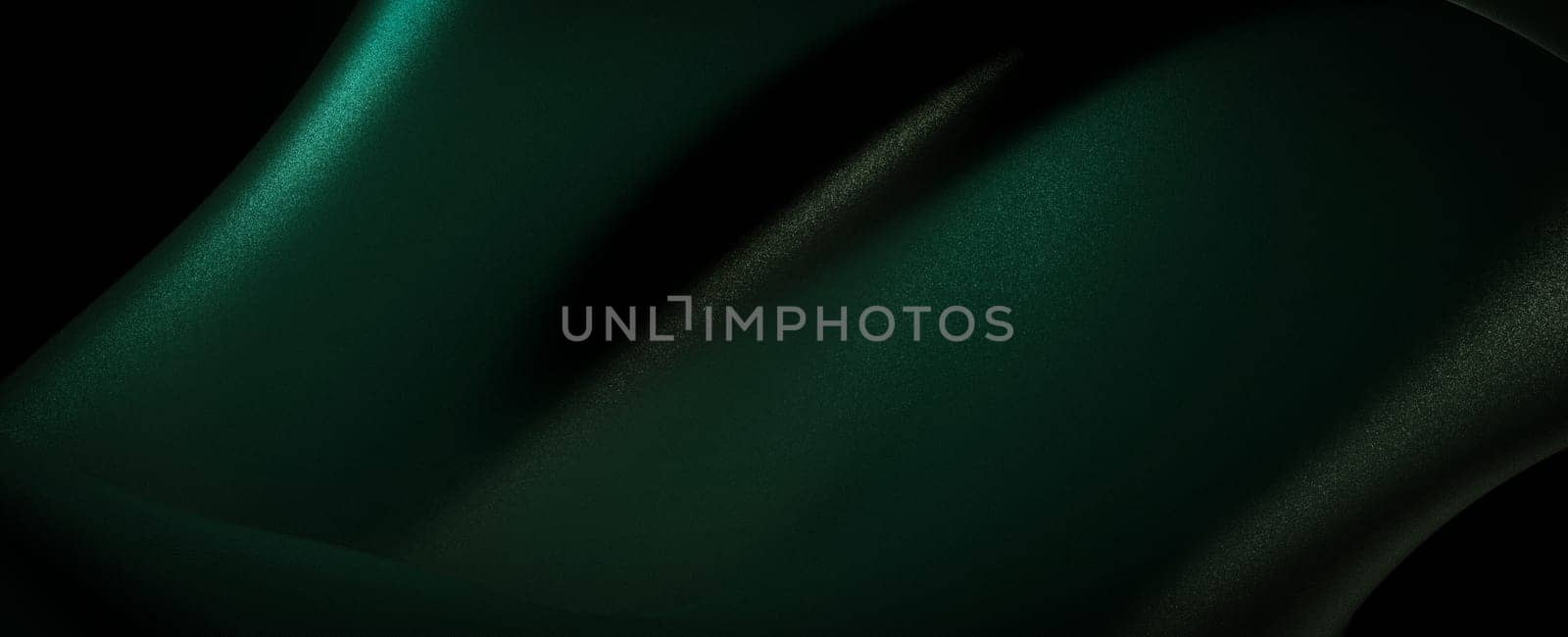 A close-up image of a smooth, green fabric texture with a dark shadow running across the surface. The image is taken with a macro lens and emphasizes the intricate details of the fabric.
