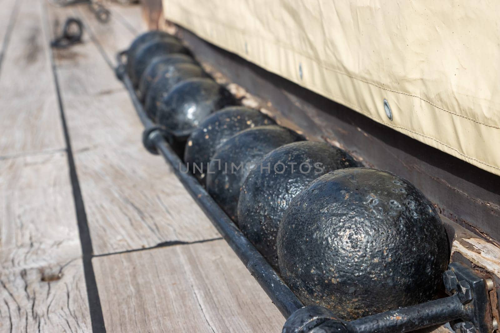 The balls cores for cannon of the 18th century on the desk of old sail battleship by Studia72