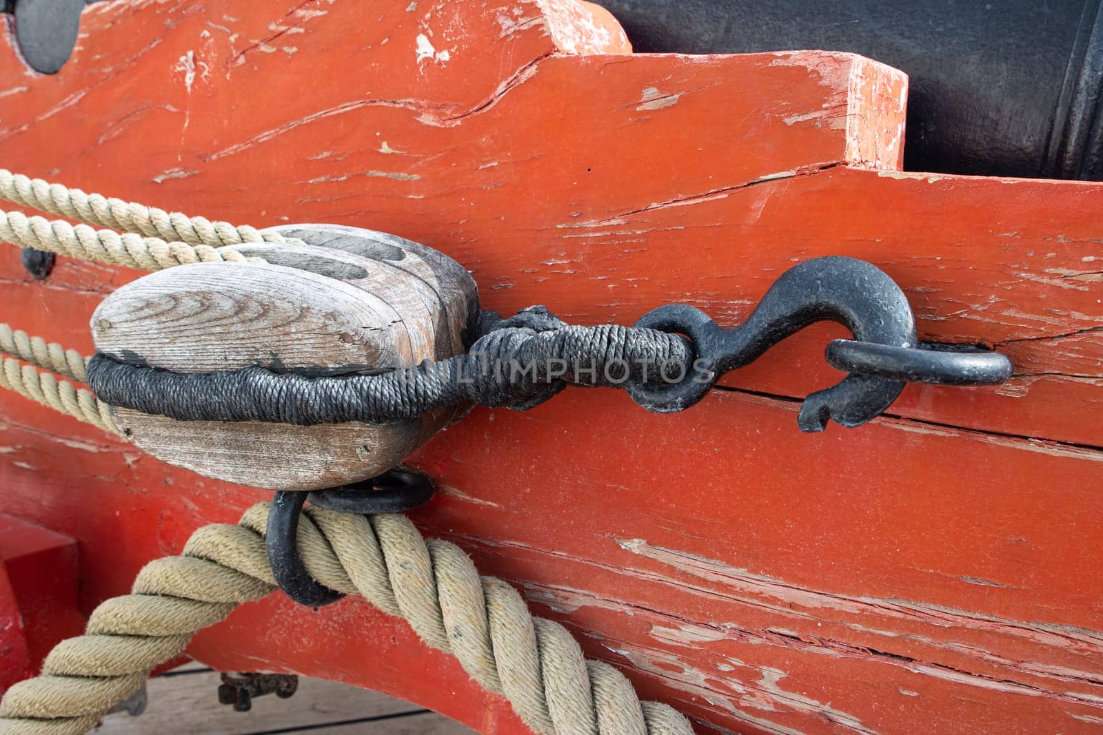 Ship's metal tackle on the deck of battle ship - military historical vessel, daylight