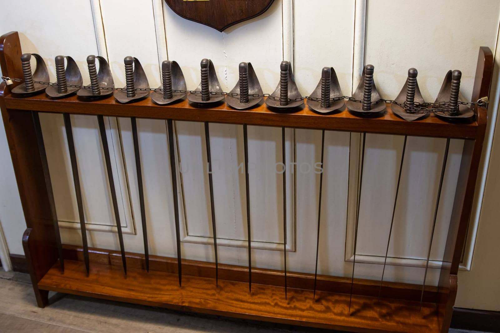 Many rapiers in the row - battle swords on the warship of 18 century - sailors soldiers, inside ship